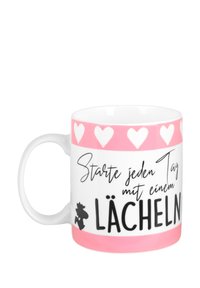 Tazza in ceramica bianca con una fascia superiore a motivo cuori rosa. Presenta testo in nero e una piccola illustrazione. Il testo include "Starte jeden Tag mit einem LÄCHELN."