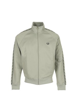 Veste de survêtement gris clair zippée avec col montant, poignets et ourlet côtelés, et logos couronne de laurier noirs sur la poitrine et les bandes des manches.