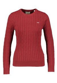 Roter Strickpullover mit Zopfmuster, Rundhalsausschnitt und geripptem Saum. Verfügt über lange Ärmel und ein kleines Logo auf der oberen linken Seite.