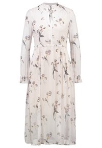 Long-sleeve, lightweight dress in cream fabric with a floral and bird print, featuring a collared neckline and a tie detail at the front.