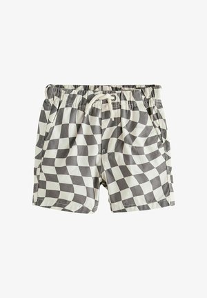 Laste ujumispüksid, millel on musta ja valget lainetavat ruudumustrit, elastne vöökoht ja valge pael.