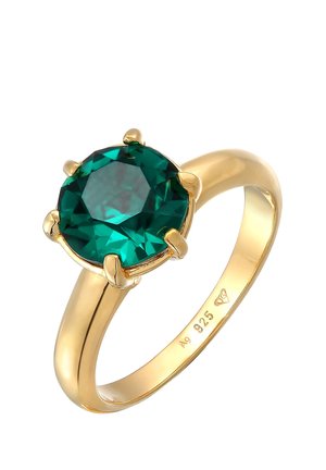 Anneau en or avec une grande pierre précieuse ronde verte tenue par six griffes, marqué "925" indiquant une base en argent sterling.