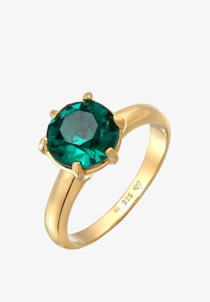 Anneau en or avec une grande pierre précieuse ronde verte tenue par six griffes, marqué "925" indiquant une base en argent sterling.