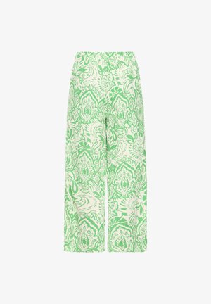 Laiade säärega püksid elastse vöökoha ja valge taustaga, millel on roheline keerukas lille- ja paisleimuster.