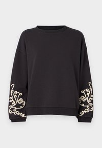 Svart hettegenser med lange ermer og rund halslinning. Har intrikate kremfargede broderier på begge mansjetter. Myk tekstur.