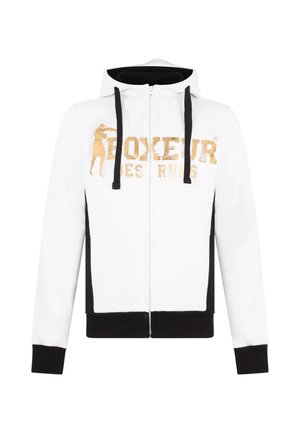 Felpa bianca con zip e accenti neri, caratterizzata da una grafica dorata "BOXEUR DES RUES" e una silhouette di pugile. Tessuto morbido, cappuccio con coulisse.