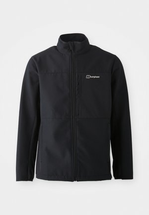 Black softshell jacket with a high collar, zip closure, and a logo on the left chest. Features two side pockets. Smooth, flexible fabric.