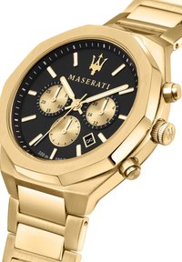 Orologio Maserati in acciaio inossidabile dorato con quadrante nero, cassa ottagonale, tre sottodial e funzione calendario. Bracciale a maglia con finitura lucida.