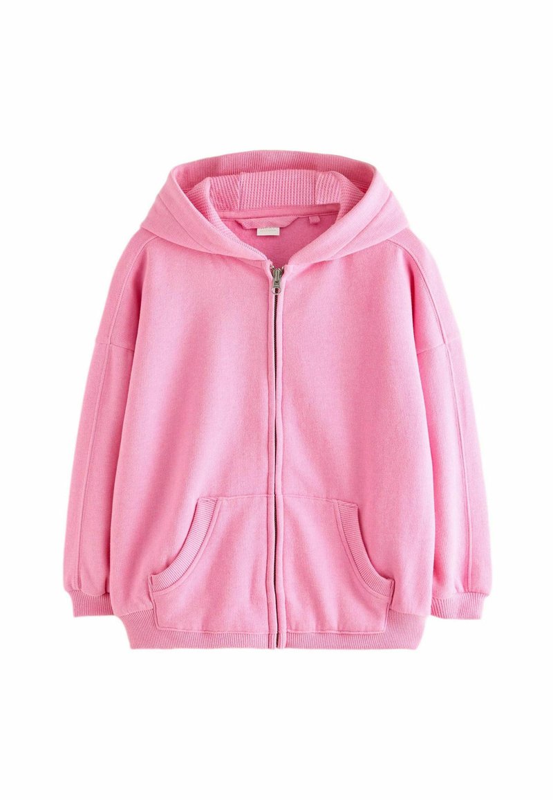Veste à zip rose avec capuche, poignets côtelés et poches avant. Le matériau a une texture douce et une silhouette décontractée.