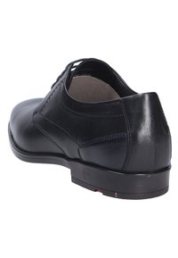 Schwarze Leder-Halbschuhe, runde Zehenform, minimalistisches Design, glatte Oberfläche, Schnürung, mit einer robusten Gummisohle und dezenten Nähten.