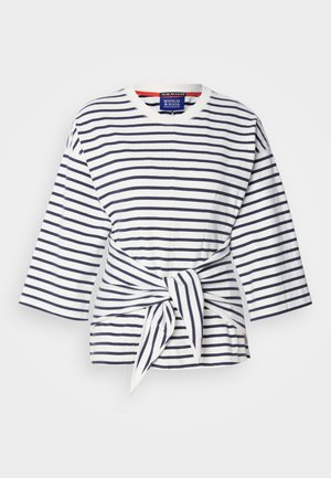 Striped, lightweight shirt in white and navy with three-quarter sleeves and a tied waist detail. Cotton fabric with a crew neckline.
