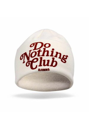 White knit beanie with rolled brim, featuring red text that reads "Do Nothing Club." Marked with "DJINNS" logo near the brim.
