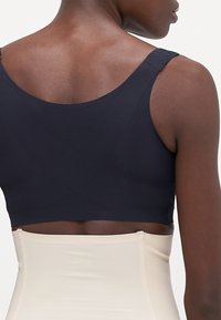MAGIC Bodyfashion POSTURE BRA - Formujúca podprsenka - black