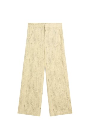 Beige hørbukser med vide ben, sidelommer, bæltestropper og frontlukning med hægte og lynlås.