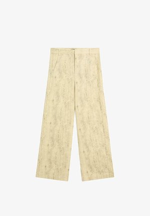 Beige hørbukser med vide ben, sidelommer, bæltestropper og frontlukning med hægte og lynlås.