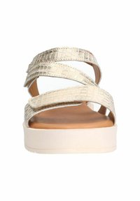 Metallic gold platform sandals with croc-embossed, crisscross straps and a smooth tan footbed. Light, supportive sole for comfort.