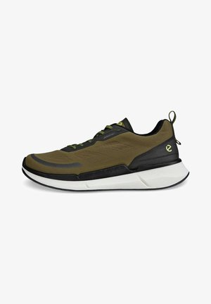 Oliwkowe buty sportowe z przewiewną cholewką, czarnymi akcentami, białą podeszwą i zielonymi sznurowadłami. Posiadają pętelkę na pięcie.