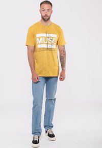 Paradiso Clothing MUSE ORIGIN OF SYMMETRY DIP DYE MINERAL WASH - Print T-shirt - yellow