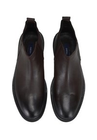 Bruine leren instappers met een glad oppervlak, ronde neus en elastische zijpanelen voor gemakkelijke instap. Zwarte rubberen zolen bieden grip.