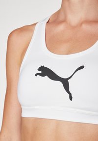 Puma KEEPS BRA - Športni modrček s srednjo podporo - white