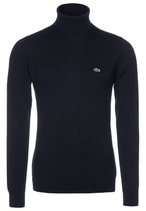 Schwarzer Langarmrollkragenpullover mit kleinem grünem Krokodil-Logo auf der linken Brust, figurbetont und mit einfarbigem Strickmuster.