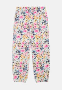 Calças leves de tecido com cintura elástica e punhos, apresentando um denso padrão floral em rosa, amarelo, azul e verde sobre um fundo branco.