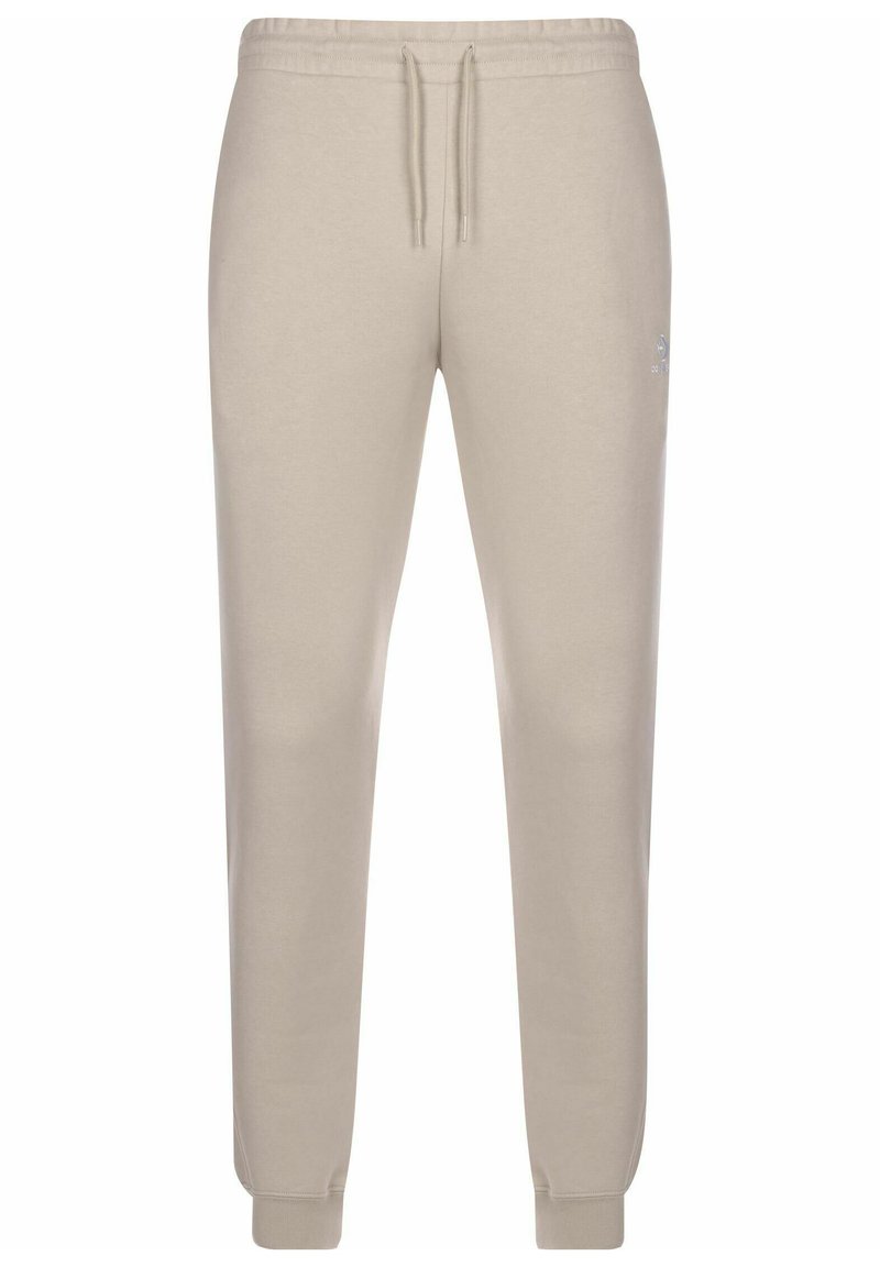 Pantaloni jogger bej cu talie elastică și șnur. Caracteristici: tivuri la glezne și un logo subtil pe lateral. Material moale dintr-un amestec de bumbac.