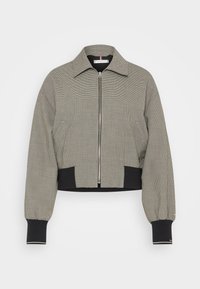 Gekürzter Bomberjacke im schwarz-weißen Karomuster, mit einem Frontreißverschluss, schwarzen gerippten Bündchen und Kragen-Details.