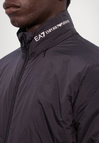 EA7 Emporio Armani GIUBBOTTO UNISEX - Giacca da mezza stagione - black