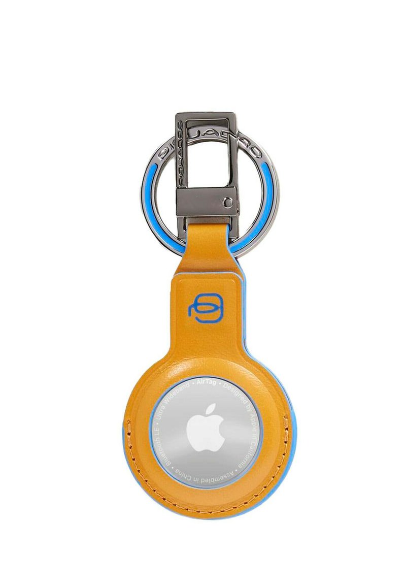 Portachiavi in pelle gialla per Apple AirTag, con dettagli blu. Design circolare e un anello metallico per l'attacco.