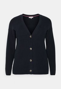 Navy knitted cardigan with V-neck, long sleeves, and five button closure. Features ribbed texture and contrasting inner collar detail.