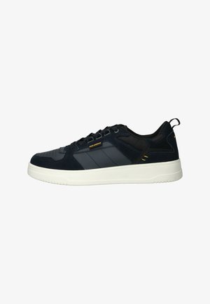 Navy blue sneakers made of leather and mesh, featuring perforated toe, white rubber sole, and yellow accent details. Classic lace-up design.