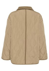 Beige kviltad jacka med en mjuk textur, som har vågmönster och en kontrasterande brun kordflodkrage. Långa ärmar och en avslappnad passform.