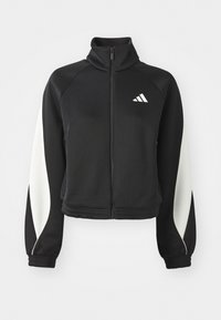 Giacca da atletica nera con zip e accenti bianchi, colletto alto e polsini aderenti. Realizzata in tessuto liscio con un logo sul lato sinistro superiore.