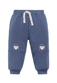 Pantalones de chándal azules para niño pequeño con cordón blanco y caras de pingüino sonrientes en las rodillas, puños acanalados y cintura elástica.