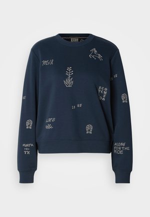 Granatowy sweatshirt wykonany z miękkiego materiału, z białym haftem i wzorami, w tym kwiatami i koniem, z prążkowanymi mankietami.