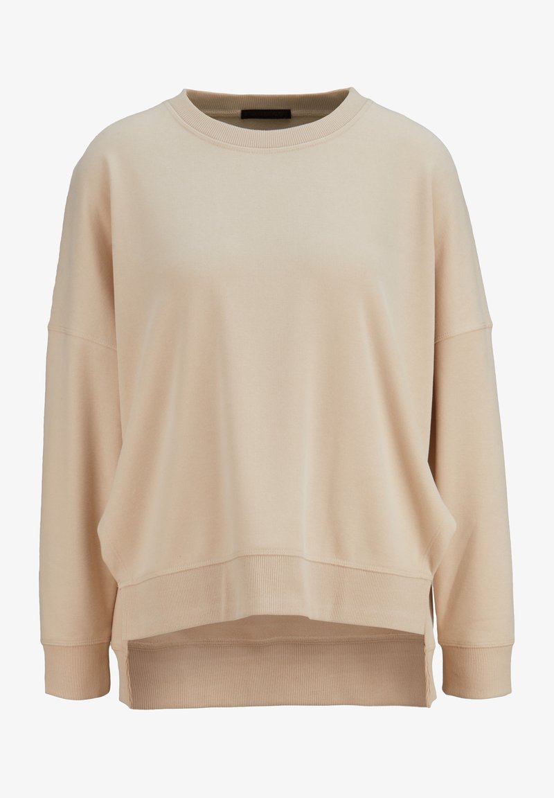 Beżowy oversize'owy sweatshirt z okrągłym dekoltem, opuszczonymi ramionami i ściągaczami u dołu rękawów. Posiada wykończenie typu high-low oraz miękki materiał z mieszanki bawełny.