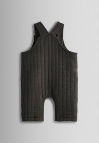 Tumedat hallid õlapaelad koos laia rihmaga ja vertikaalsete joontega kätkeb avatud alt. Pehme kangas sileda tekstuuriga.