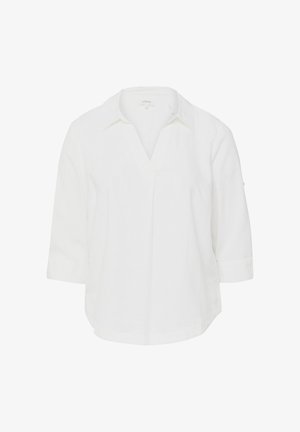Blouse blanche à manches longues avec col, ouverture en V et ourlet légèrement arrondi, présentée sur un fond blanc uni.
