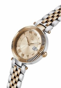 Orologio metallico con bracciale oro e argento. Il quadrante rotondo presenta un quadrante oro testurizzato, numeri romani e una visualizzazione della data alle 3.