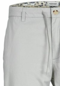 Pantaloni grigi a sigaretta con fascia elastica in vita, apertura con cerniera e un motivo decorativo di palme all'interno della fascia.