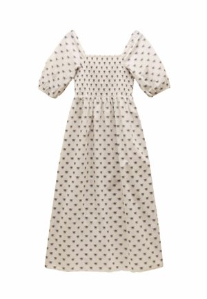 Krémové šaty so štvorcovým výstrihom, krátkymi puffovými rukávmi, nariasenou sukňou a celoplošným kvetinovým vzorom. Dlhý, splývavý strih.