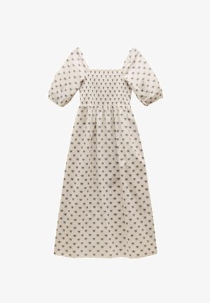 Krémové šaty so štvorcovým výstrihom, krátkymi puffovými rukávmi, nariasenou sukňou a celoplošným kvetinovým vzorom. Dlhý, splývavý strih.