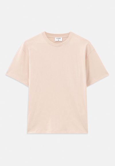 Short-sleeve t-shirt in light beige, made of soft cotton. Round neckline, relaxed fit, with straight hem and no patterns or graphics.