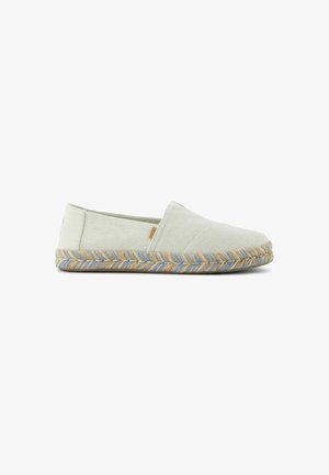 Light green canvas slip-on shoe with a textured finish, featuring a jute sole accented with blue and natural fibers, rounded toe design.