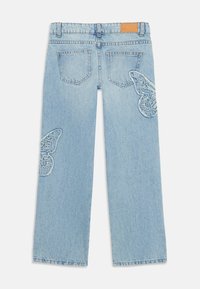 Light blue wide-leg jeans with a high waist and butterfly embroidery on both legs, featuring two back pockets and a leather patch at the waist.
