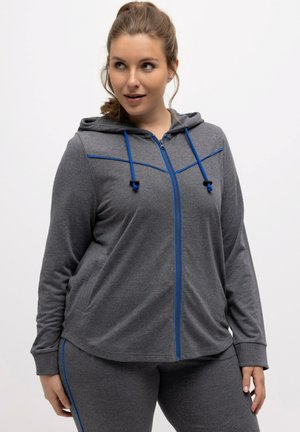 Gray zip-up hoodie with blue accents, two side pockets, and drawstrings. Soft texture, relaxed fit, suitable for casual wear or exercise.