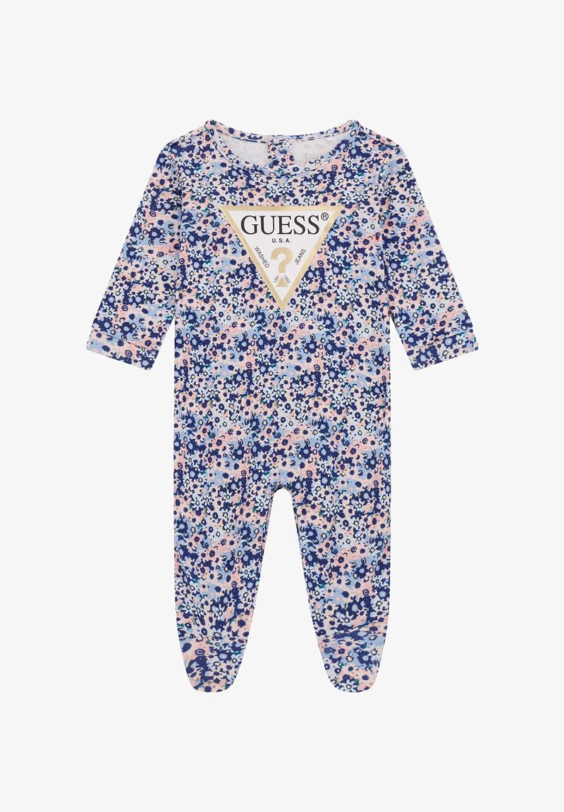 Blommönstrad jumpsuit i blå och rosa nyanser, långa ärmar, rund halsringning, med en central triangulär logotyp med varumärkesnamn.