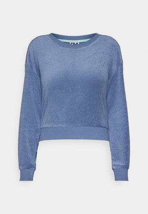 Sininen lyhythihainen collegepusero pehmeästä, teksturoidusta kankaasta, jossa on resorit hihansuissa ja kauluksessa. Sisältää pienen logonapin kaula-aukossa.