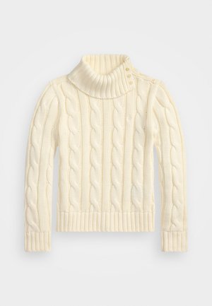 Pull en tricot beige clair avec un col haut et rabattu, doté de quatre boutons à l'épaule, ainsi que de poignets et d'un ourlet côtelés.